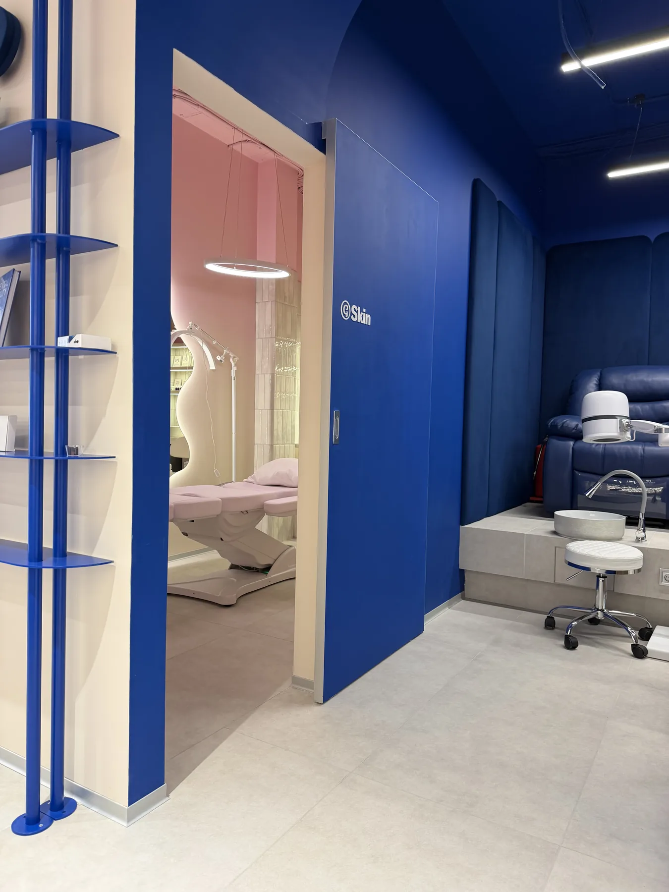 Entrance to blue pedicure room and pink treatment area in G-Bar Sofia