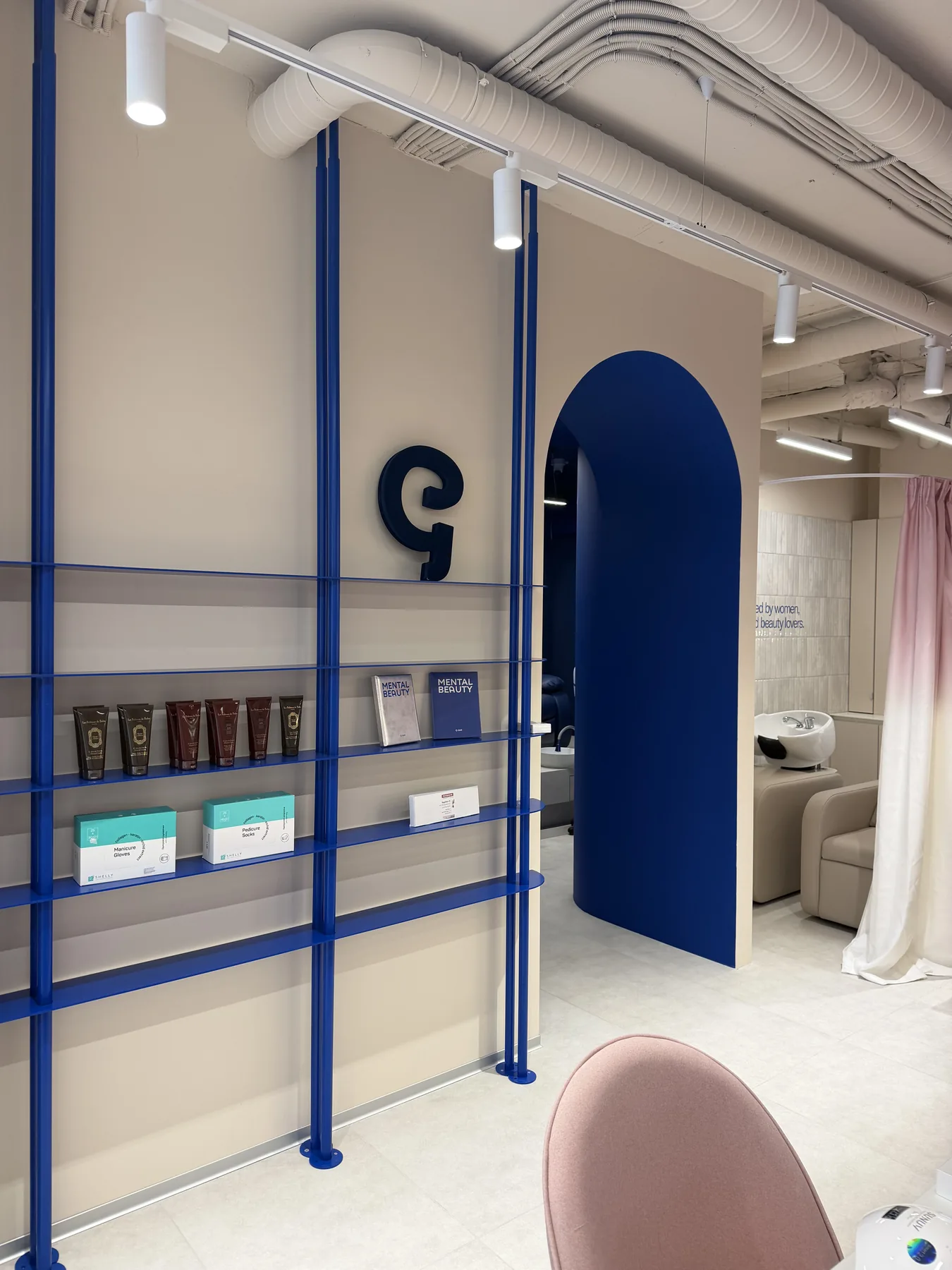 Cosmetics display shelves and blue arch after G-Bar Sofia renovation works