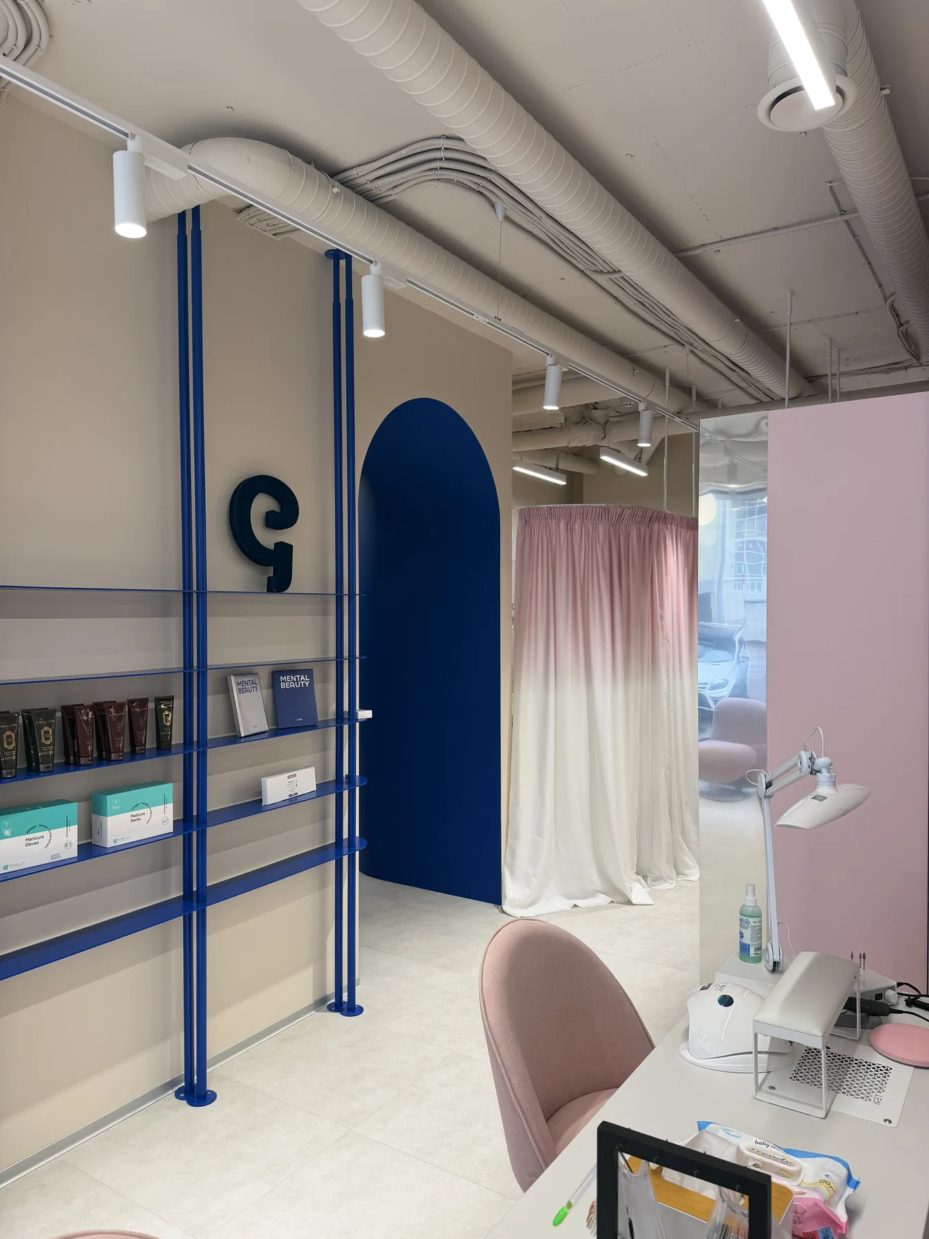 Retail display and treatment area detail in G-Bar Sofia beauty salon