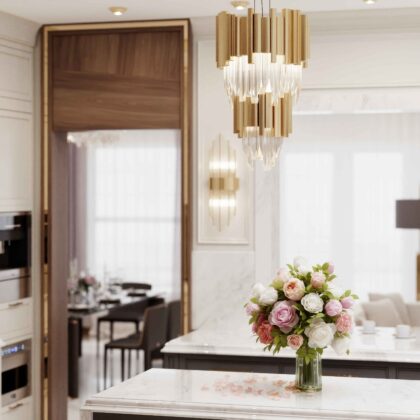 Versace apartments luxury kitchen island with marble countertop gold chandelier and flower bouquet by Danica Space