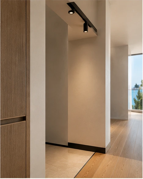 Apartment renovation Croatia detail with warm flooring, clean wall finish and custom joinery edge